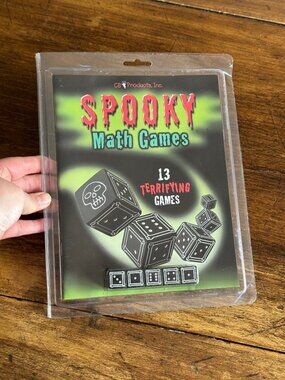 Spooky Math Dice Game with Black Dice Showing Skull Symbol